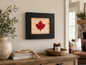 Reclaimed wood Canadian maple leaf wall art with black frame, styled above a rustic console table in a warm cottage living room