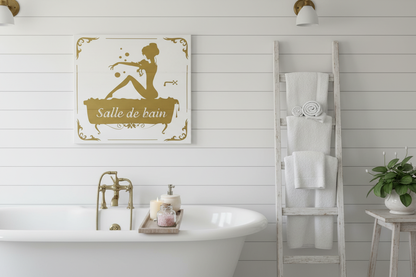 Salle de bain white wood sign with gold silhouette hung on shiplap wall in elegant cottage bathroom with clawfoot tub and fluffy towels